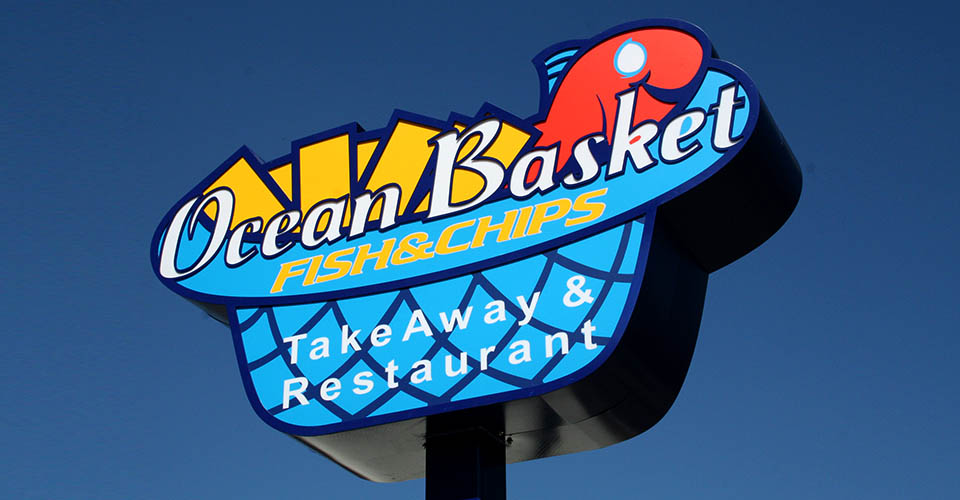 Steel totem pole signage with vinyl covered acrylic logo